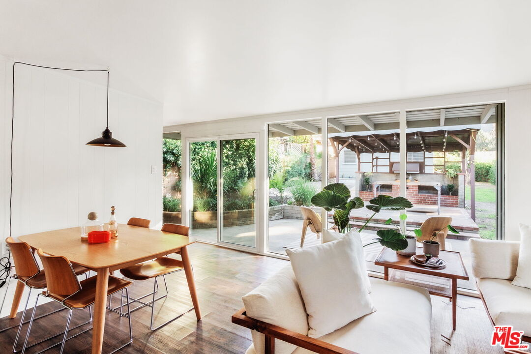 7606 Valmont Street Tujunga, CA 91042 - Photo 5 of 24 a dining room with furniture and a floor to ceiling window