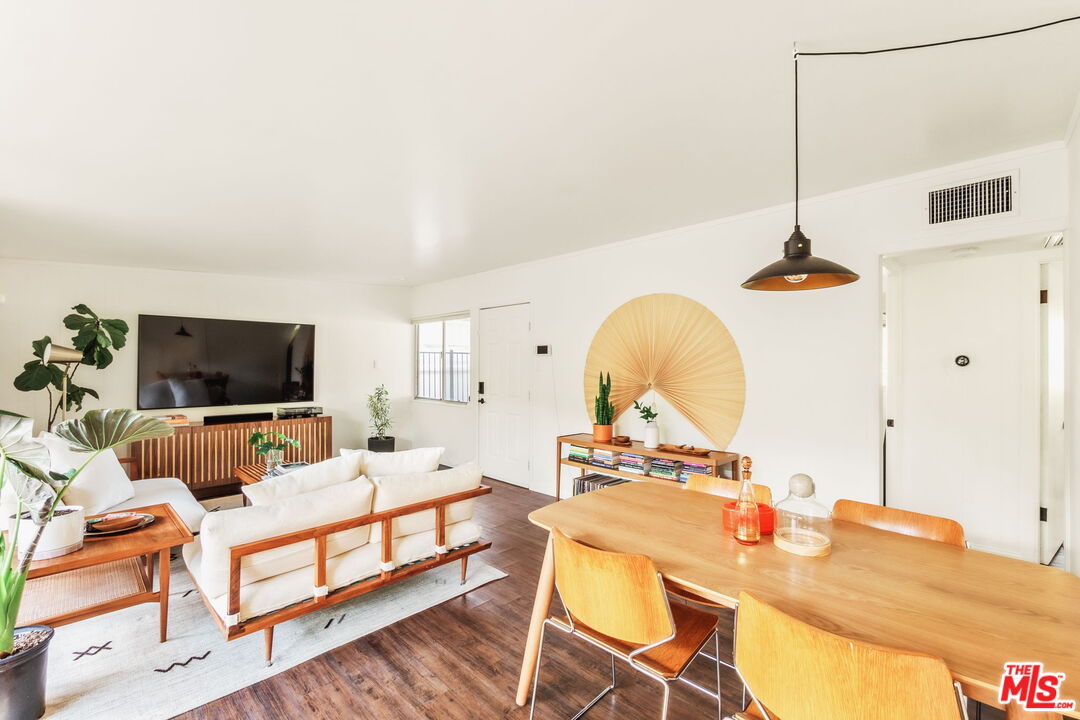 7606 Valmont Street Tujunga, CA 91042 - Photo 6 of 24 a living room with furniture and a flat screen tv