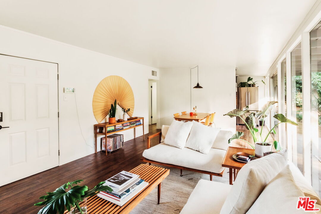 7606 Valmont Street Tujunga, CA 91042 - Photo 7 of 24 a living room with furniture and a wooden floor