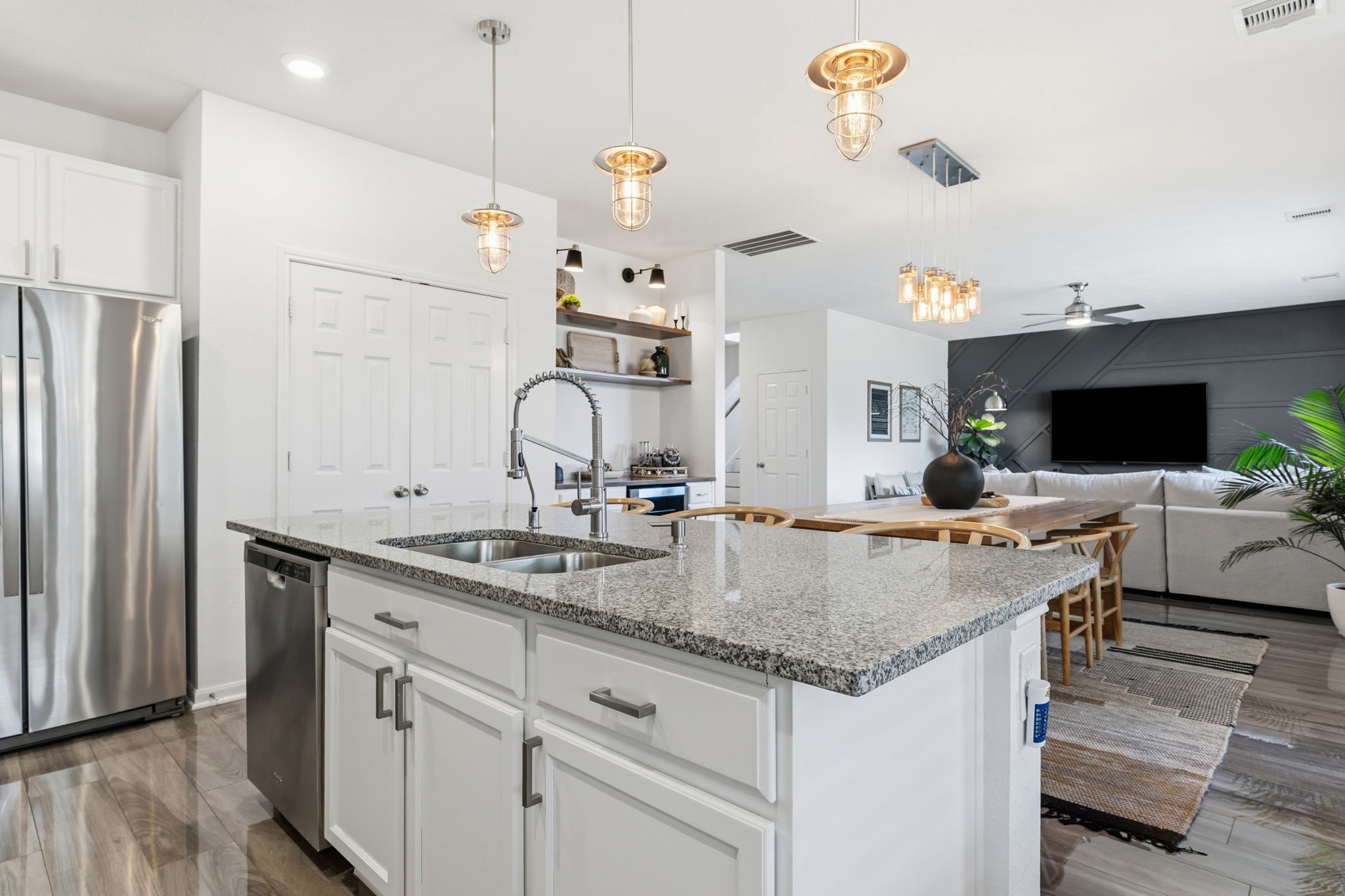 5127 Avondale Rise Street Katy, TX 77493 - Photo 17 of 47 a kitchen with a sink and refrigerator