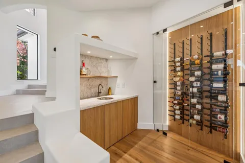 a bathroom with a bathtub sink and mirror