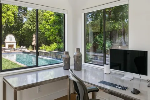a view of a dining room with furniture and window