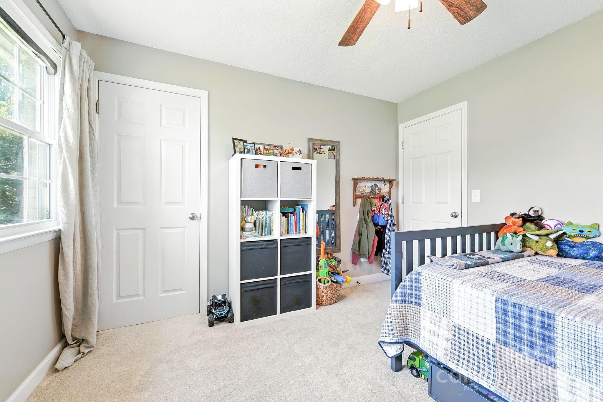 131 Sheffield Road Mocksville, NC 27028 - Photo 18 of 21 a bedroom with furniture and white walls