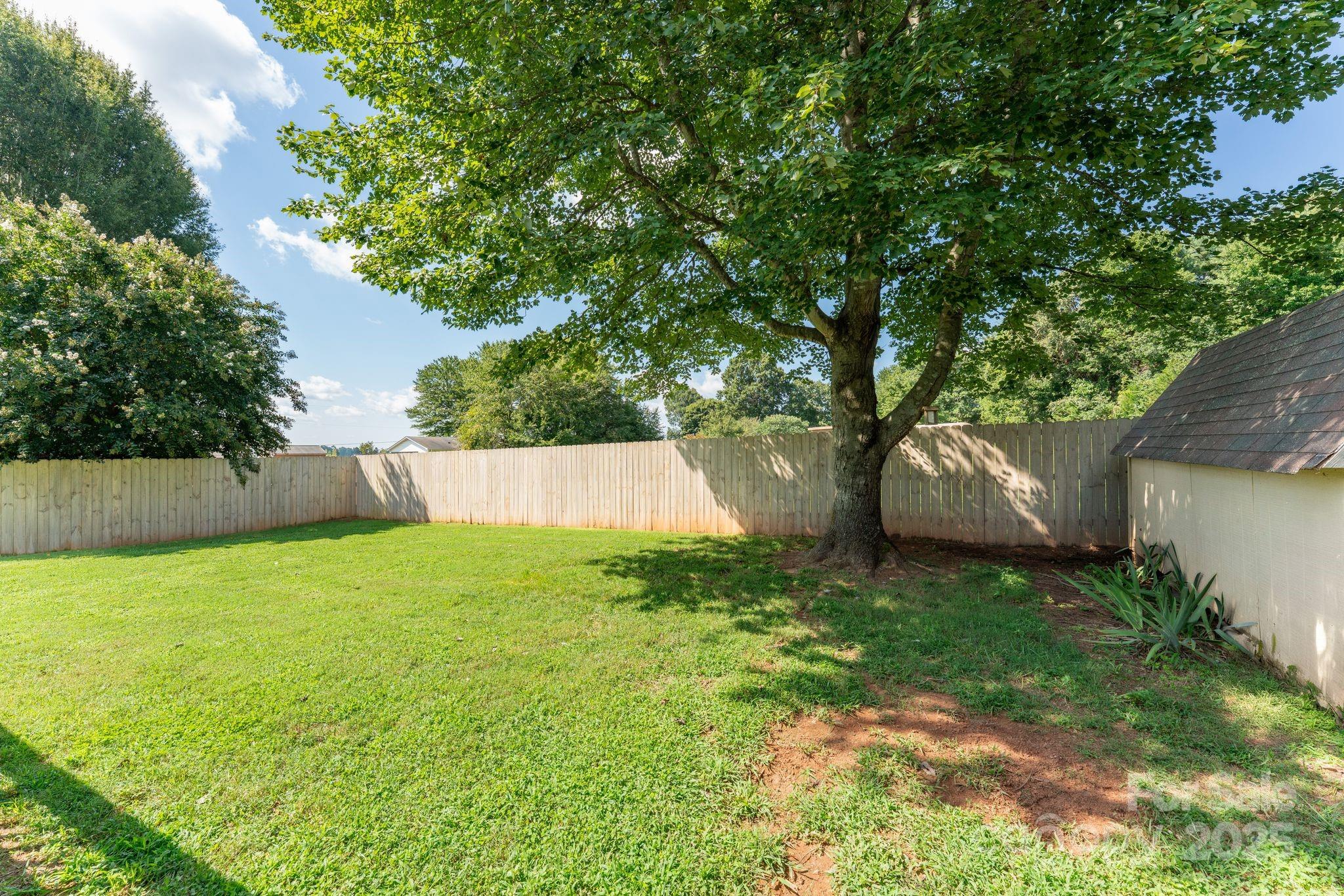 131 Sheffield Road Mocksville, NC 27028 - Photo 19 of 21 a view of a backyard with a small cabin