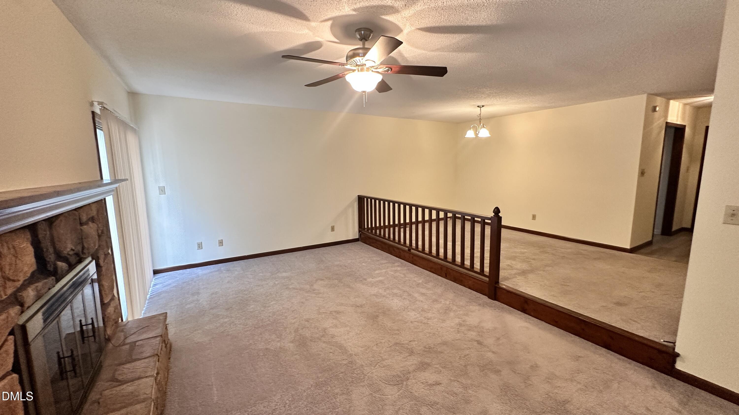 4705 Fargo Court, Unit B Raleigh, NC 27612 - Photo 2 of 9 a view of a livingroom with a ceiling fan and window