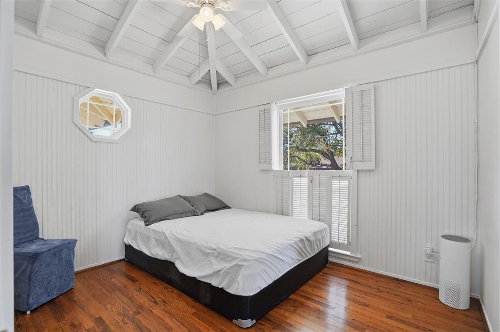 13280 Beach Club Road The Colony, TX 75056 - Photo 19 of 40 a bedroom with a bed and wooden floor