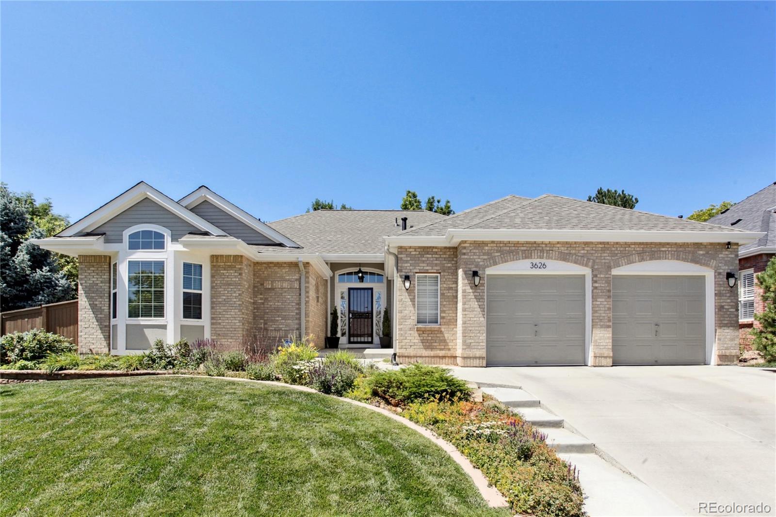 3626 Pointer Way Highlands Ranch, CO 80126 - Photo 1 of 33 a front view of a house with garden