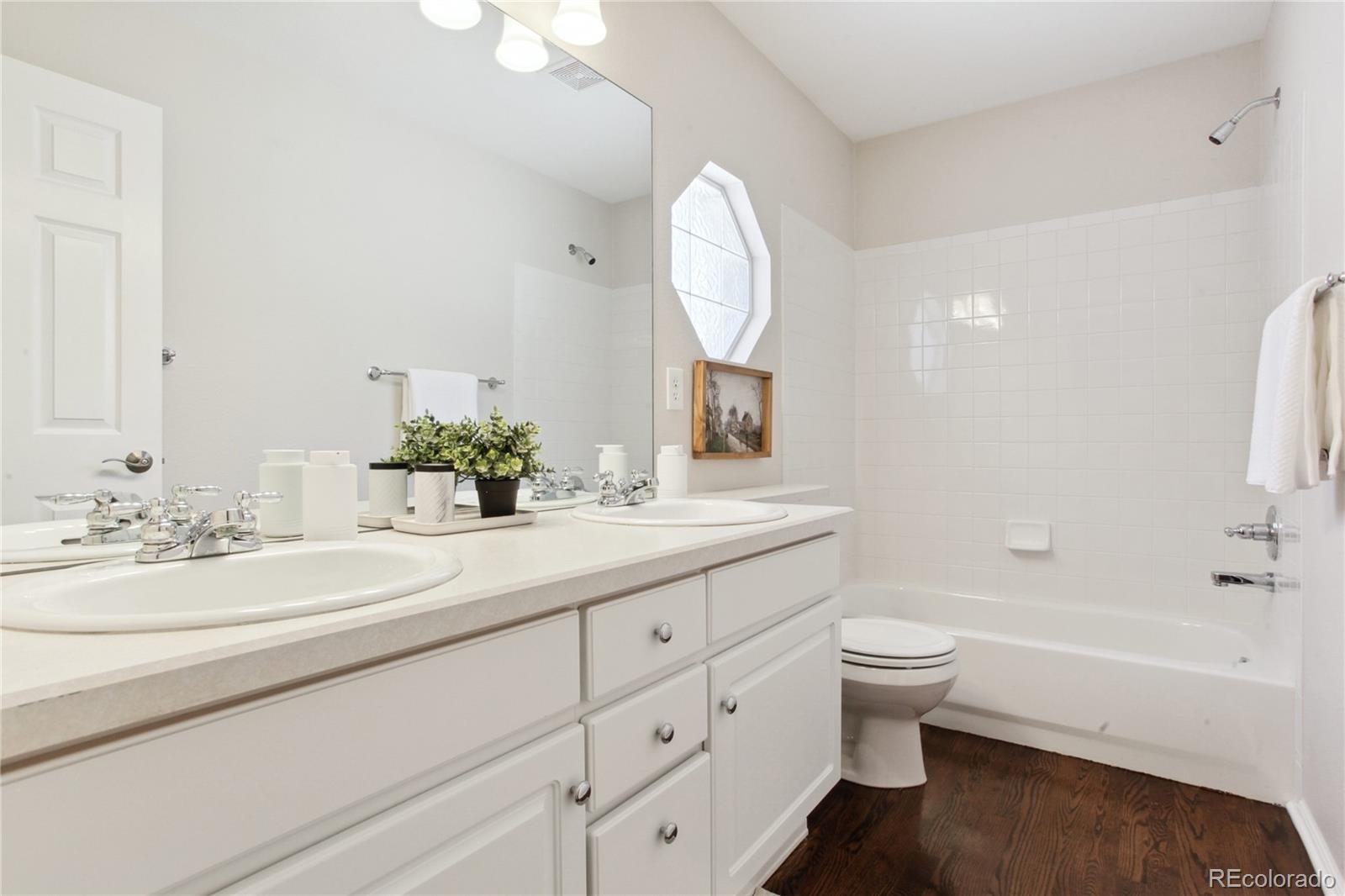 3626 Pointer Way Highlands Ranch, CO 80126 - Photo 15 of 33 a bathroom with a sink a toilet and a bathtub