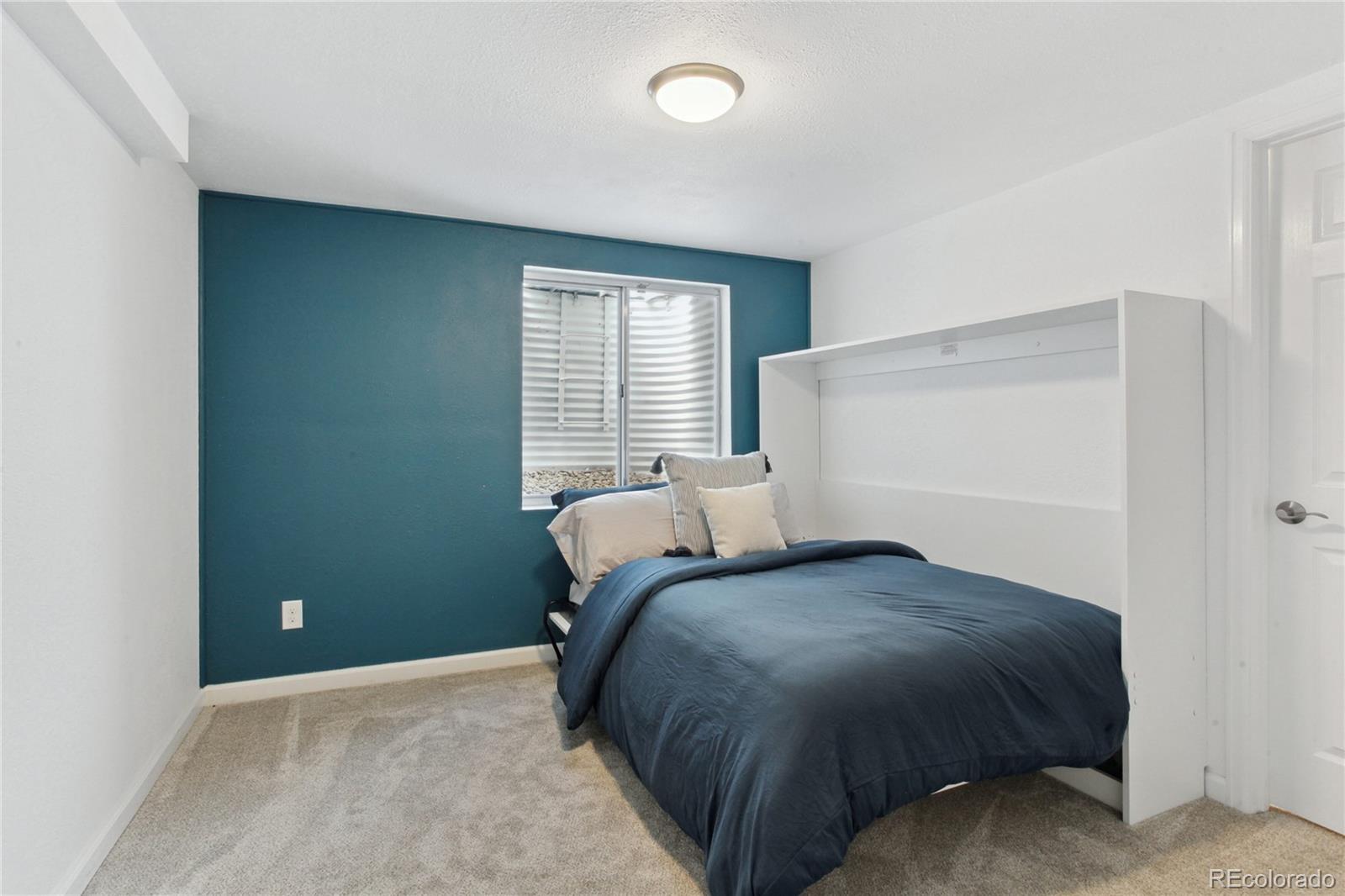 3626 Pointer Way Highlands Ranch, CO 80126 - Photo 20 of 33 a bedroom with a bed and a window
