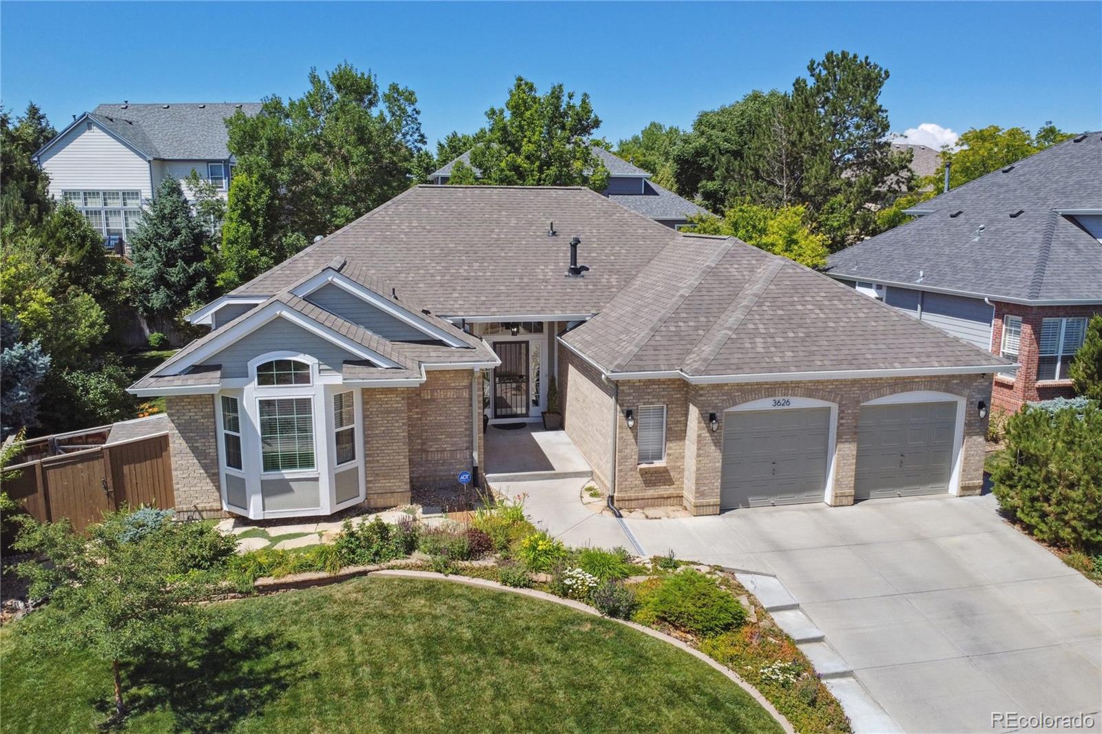 3626 Pointer Way Highlands Ranch, CO 80126 - Photo 2 of 33 an aerial view of a house with a yard and potted plants