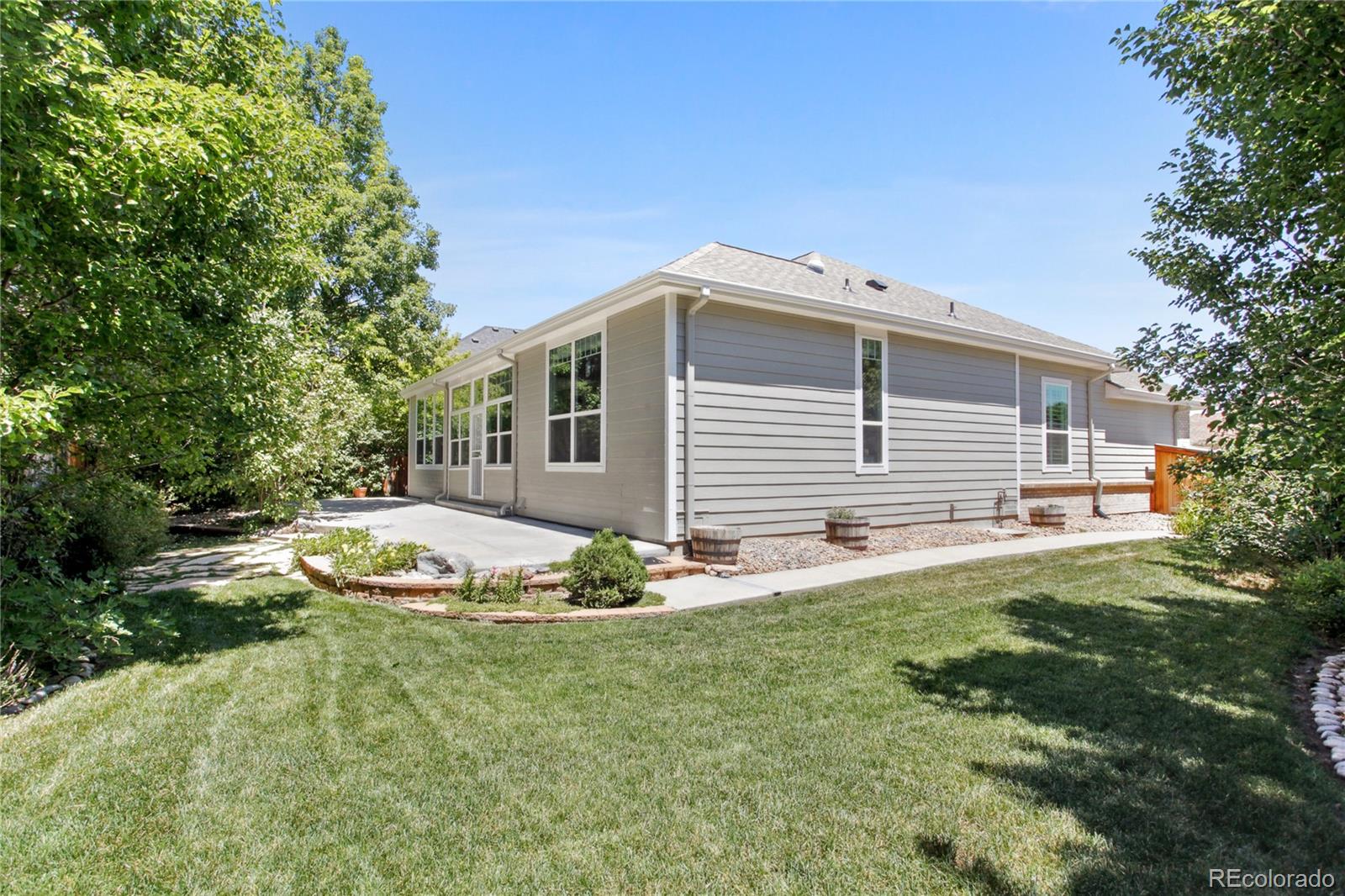 3626 Pointer Way Highlands Ranch, CO 80126 - Photo 25 of 33 a front view of a house with a yard