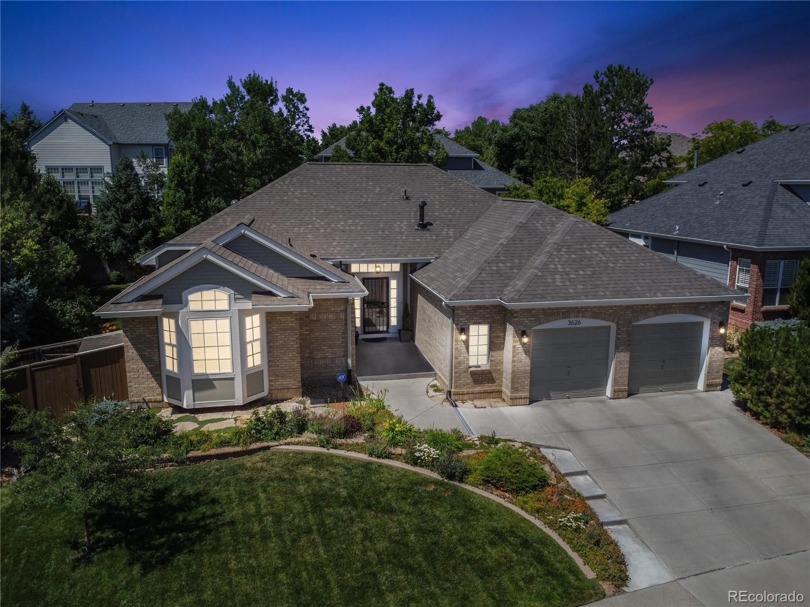 3626 Pointer Way Highlands Ranch, CO 80126 - Photo 27 of 33 a front view of a house with a yard and trees