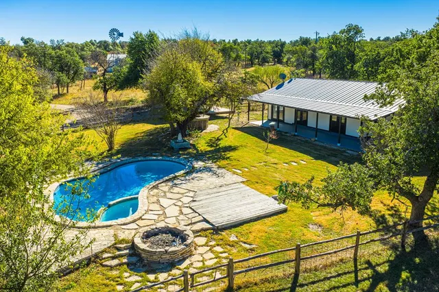 a view of a swimming pool with lounge chair