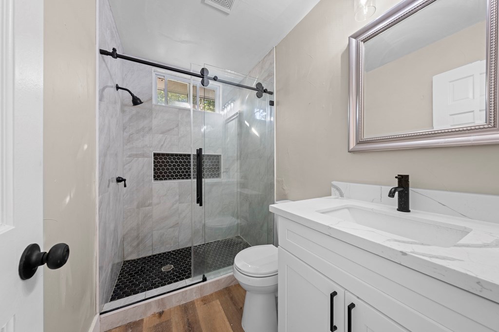 28 Ruger Road Fredericksburg, TX 78624 - Photo 11 of 43 a bathroom with a sink a toilet and a shower