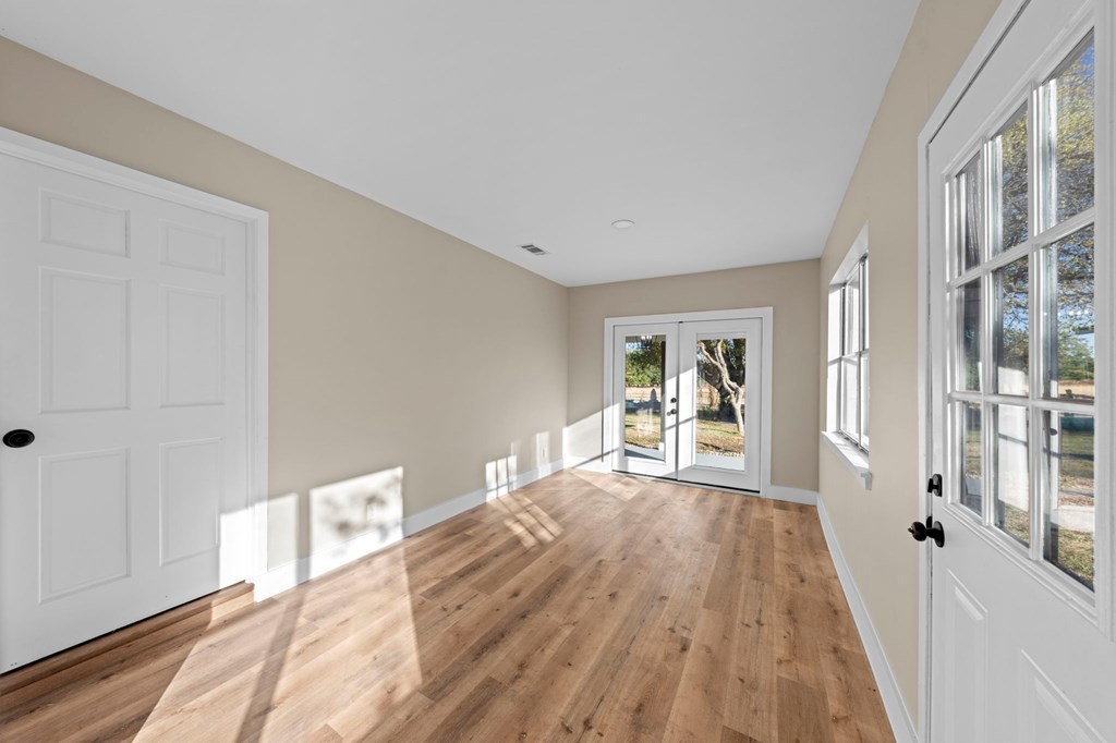 28 Ruger Road Fredericksburg, TX 78624 - Photo 12 of 43 a bedroom with a bed and a large window with outer view