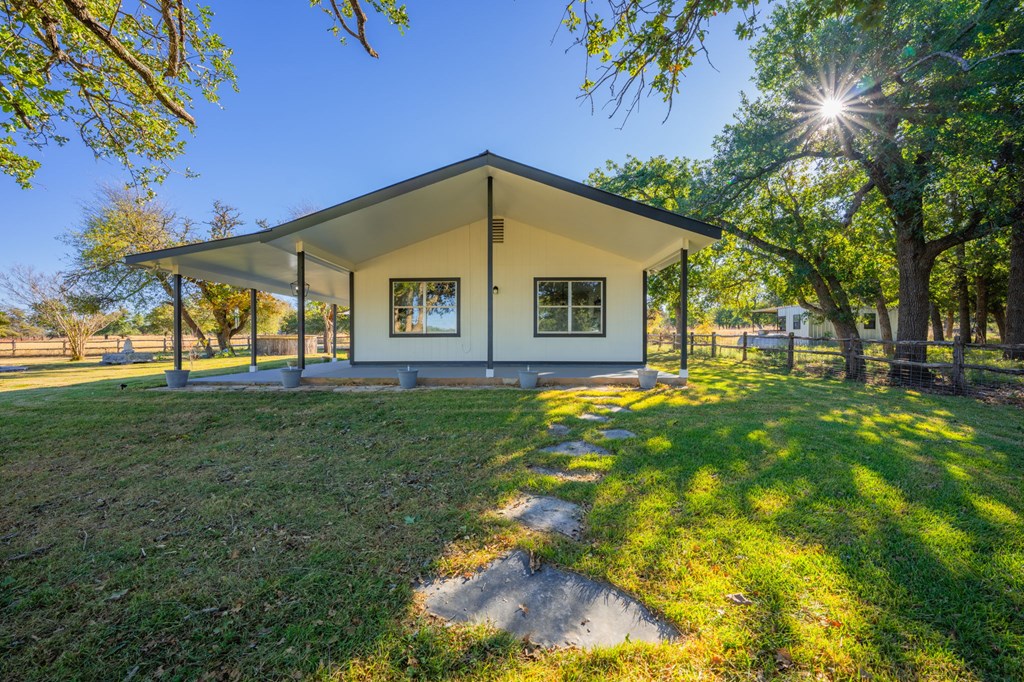 28 Ruger Road Fredericksburg, TX 78624 - Photo 2 of 43 a view of a house with yard and tree s
