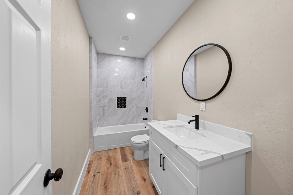 28 Ruger Road Fredericksburg, TX 78624 - Photo 26 of 43 a bathroom with a sink a toilet and a mirror