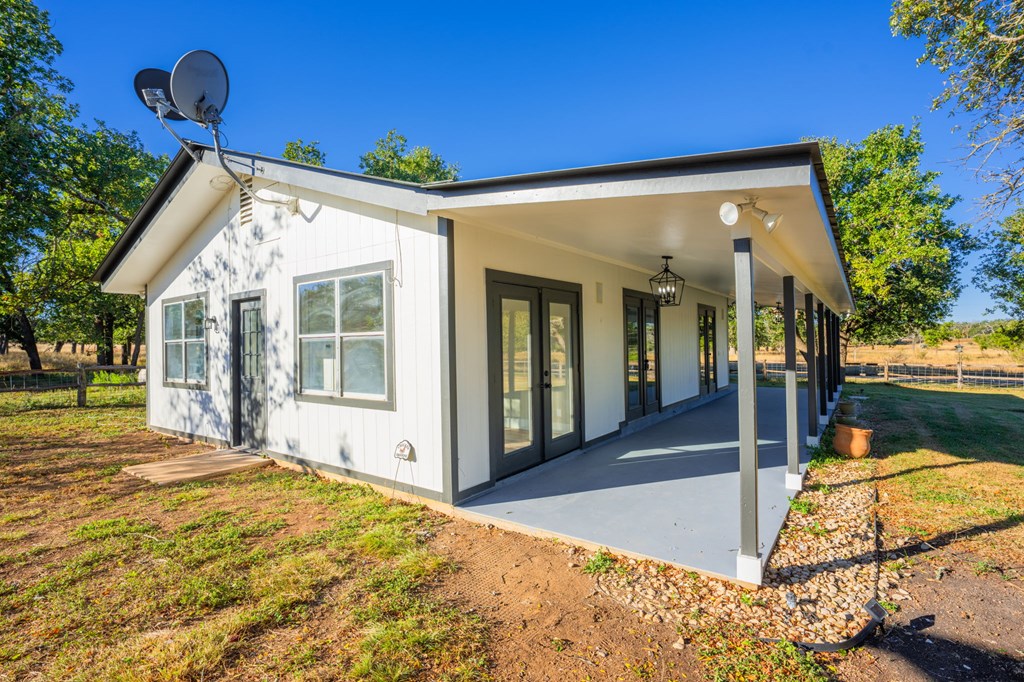 28 Ruger Road Fredericksburg, TX 78624 - Photo 3 of 43 a view of a house with backyard and sitting area