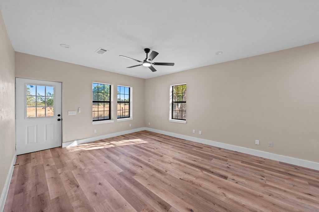 28 Ruger Road Fredericksburg, TX 78624 - Photo 31 of 43 a view of empty room with wooden floor and fan