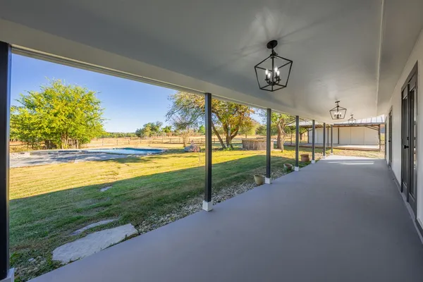a view of a kitchen center island and wooden floor