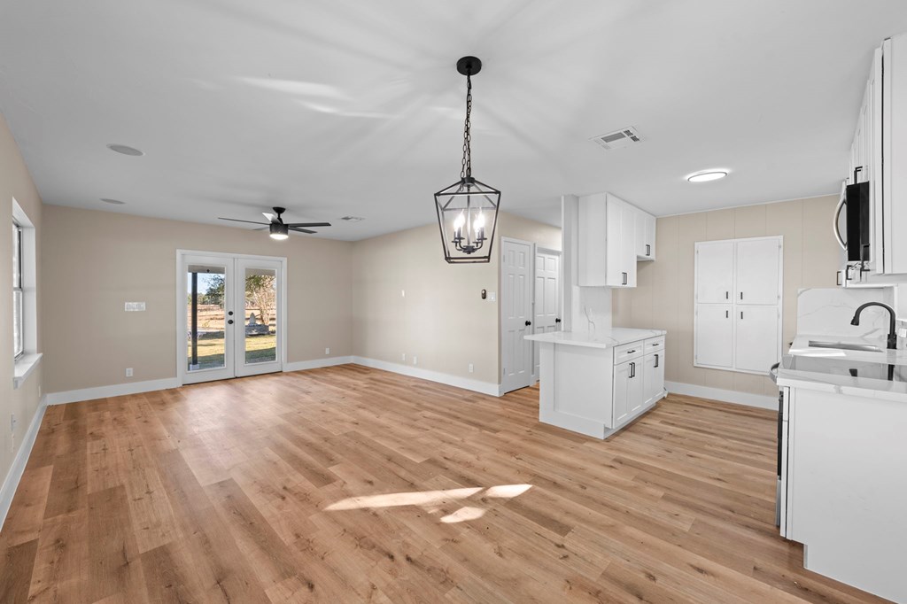 28 Ruger Road Fredericksburg, TX 78624 - Photo 5 of 43 a view of a kitchen center island and wooden floor