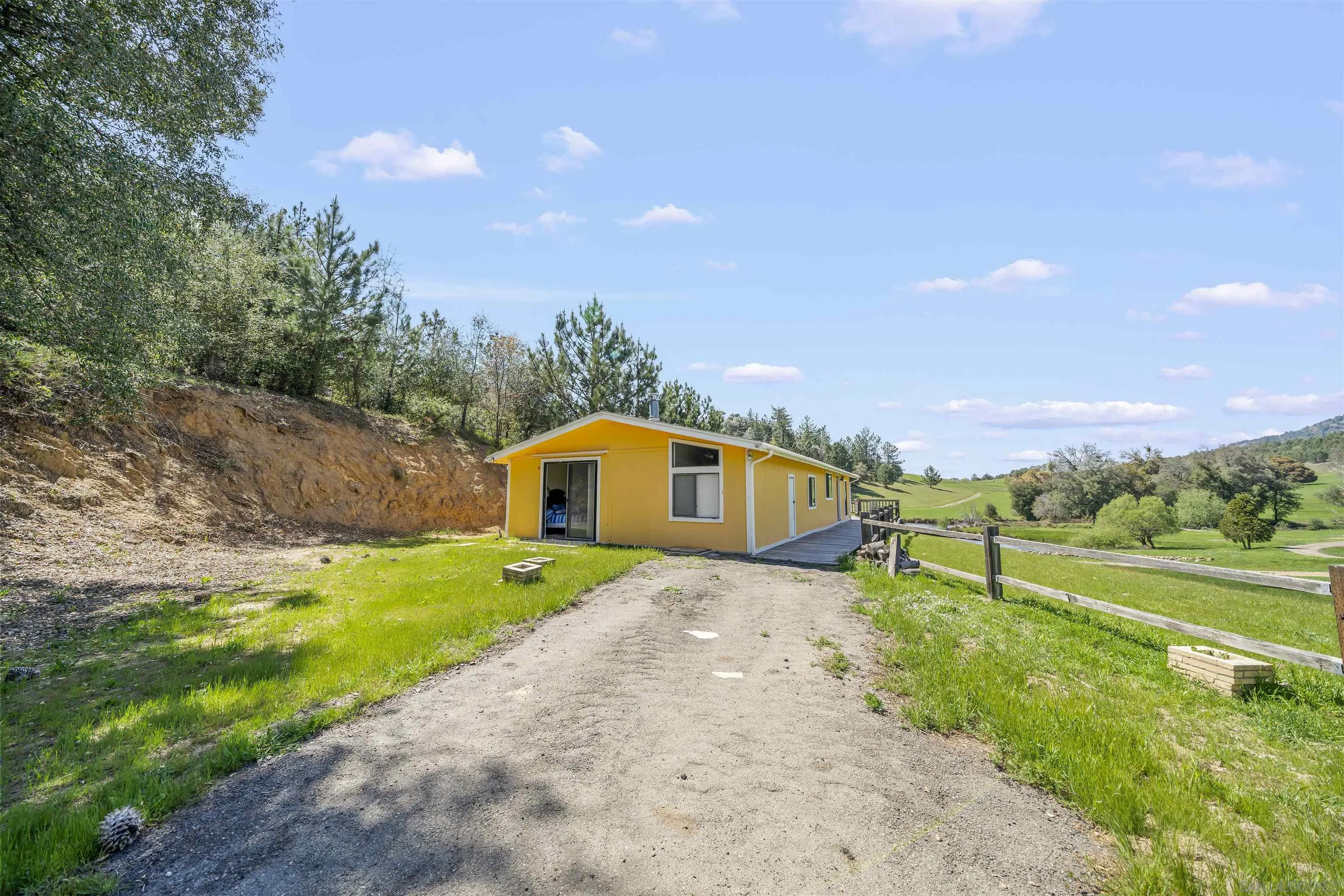 2464 Wynola Road Julian, CA 92036 - Photo 22 of 50 a view of a back yard of the house