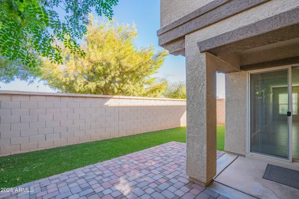 a view of backyard with tub