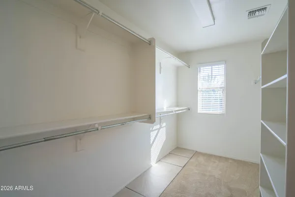 a view of an empty walk in closet