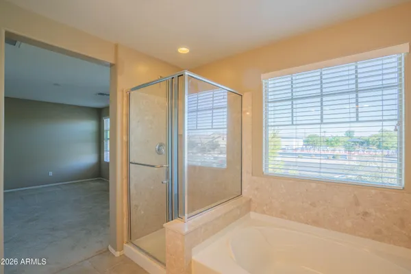 a bathroom with a bathtub and a shower