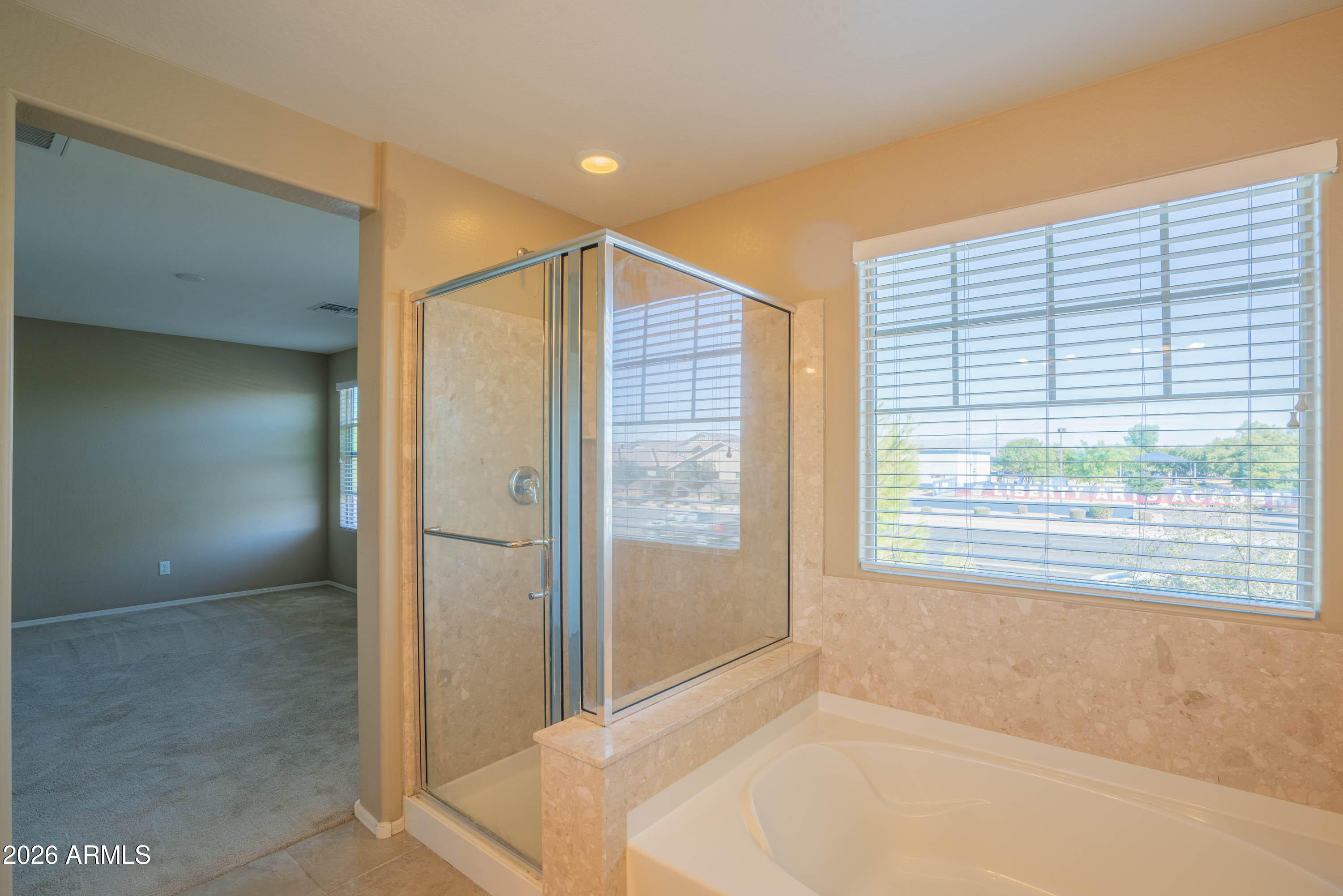 533 North Ranger Trail Gilbert, AZ 85234 - Photo 28 of 35 a bathroom with a bathtub and a shower
