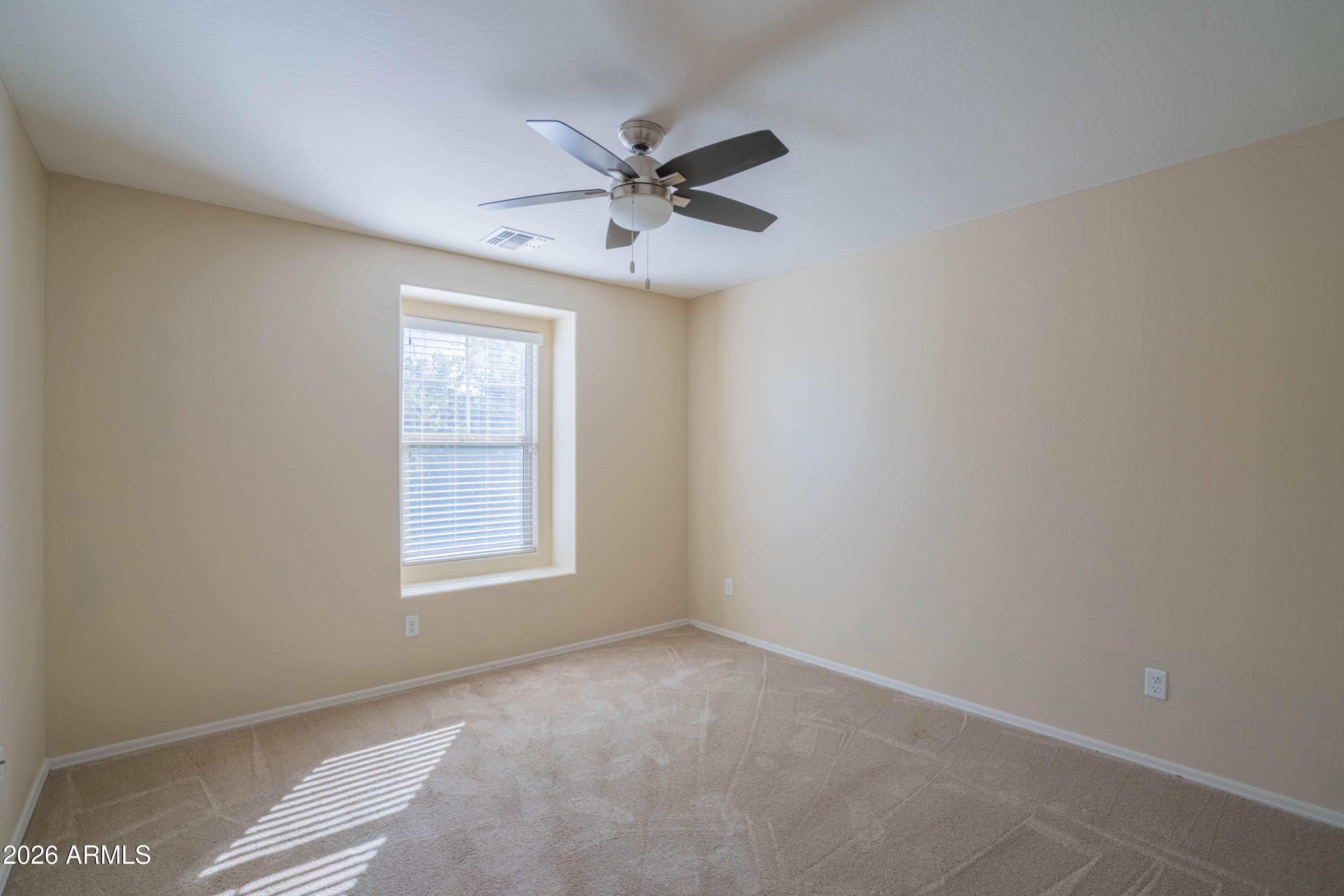 533 North Ranger Trail Gilbert, AZ 85234 - Photo 32 of 35 an empty room with windows and fan