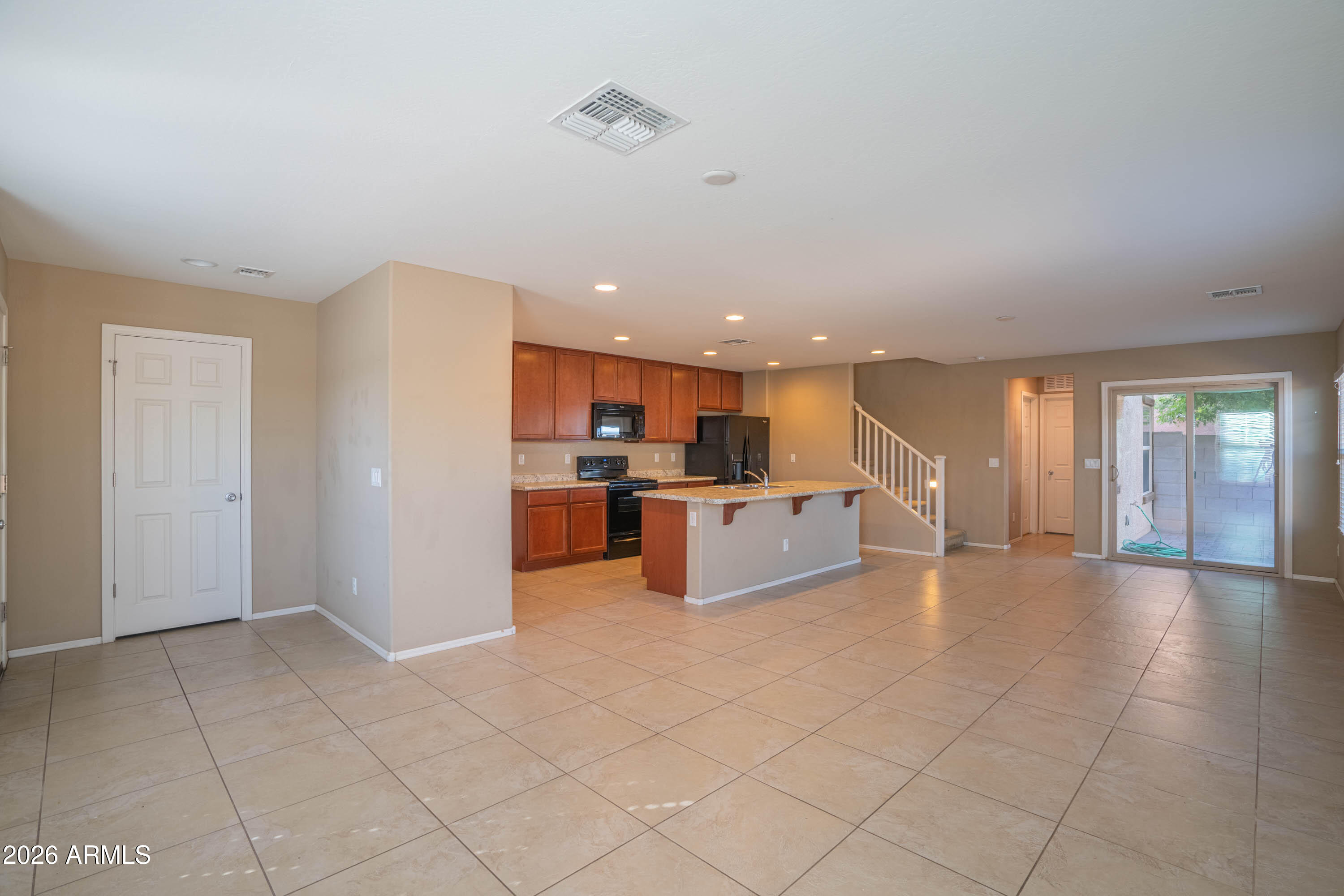 533 North Ranger Trail Gilbert, AZ 85234 - Photo 6 of 35 a view of kitchen with kitchen island stainless steel appliances refrigerator sink and cabinets