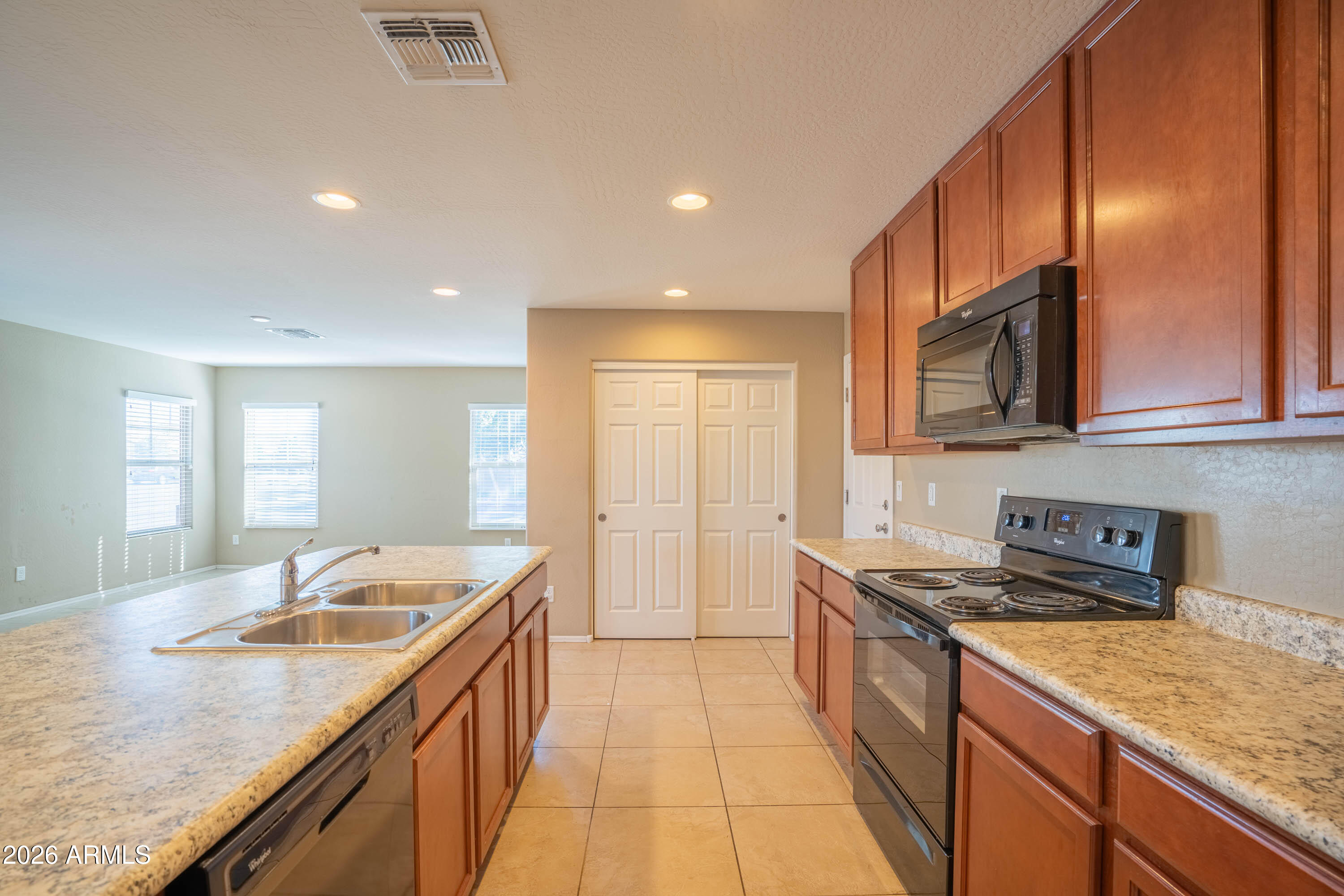 533 North Ranger Trail Gilbert, AZ 85234 - Photo 8 of 35 a kitchen with a sink stove and cabinets