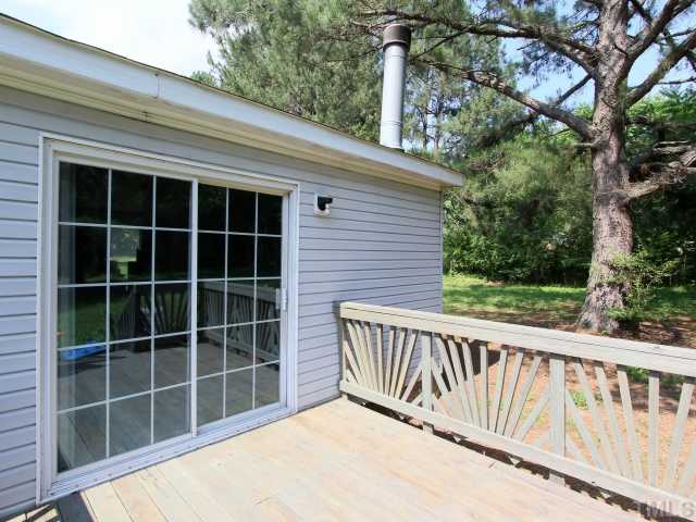 4902 West Ten Road Efland, NC 27243 - Photo 21 of 25 a view of a house with a window