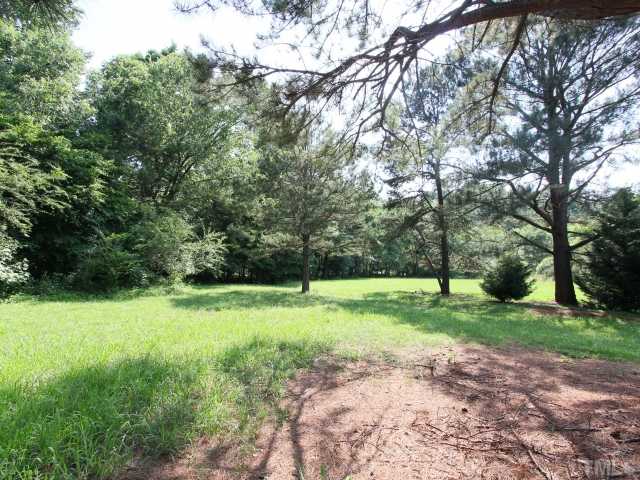 4902 West Ten Road Efland, NC 27243 - Photo 23 of 25 a view of a big yard with plants and large trees