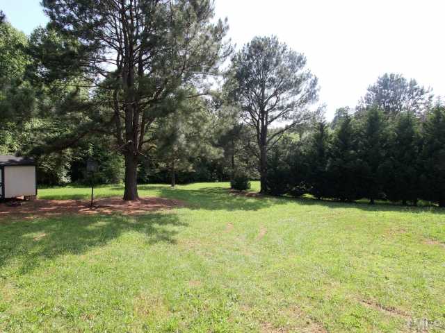 4902 West Ten Road Efland, NC 27243 - Photo 24 of 25 a view of swimming pool with a yard