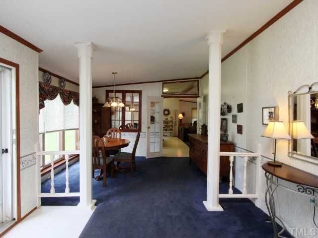 4902 West Ten Road Efland, NC 27243 - Photo 3 of 25 a view of living room kitchen and entryway