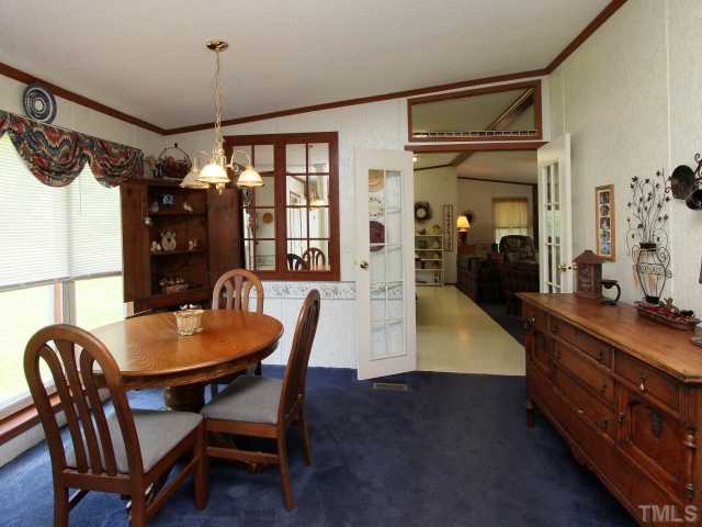4902 West Ten Road Efland, NC 27243 - Photo 7 of 25 a dining room with furniture and window