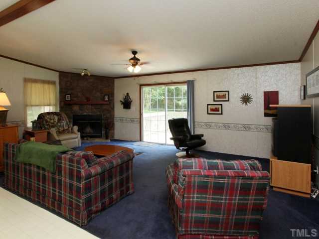 4902 West Ten Road Efland, NC 27243 - Photo 8 of 25 a bedroom with bed and a window