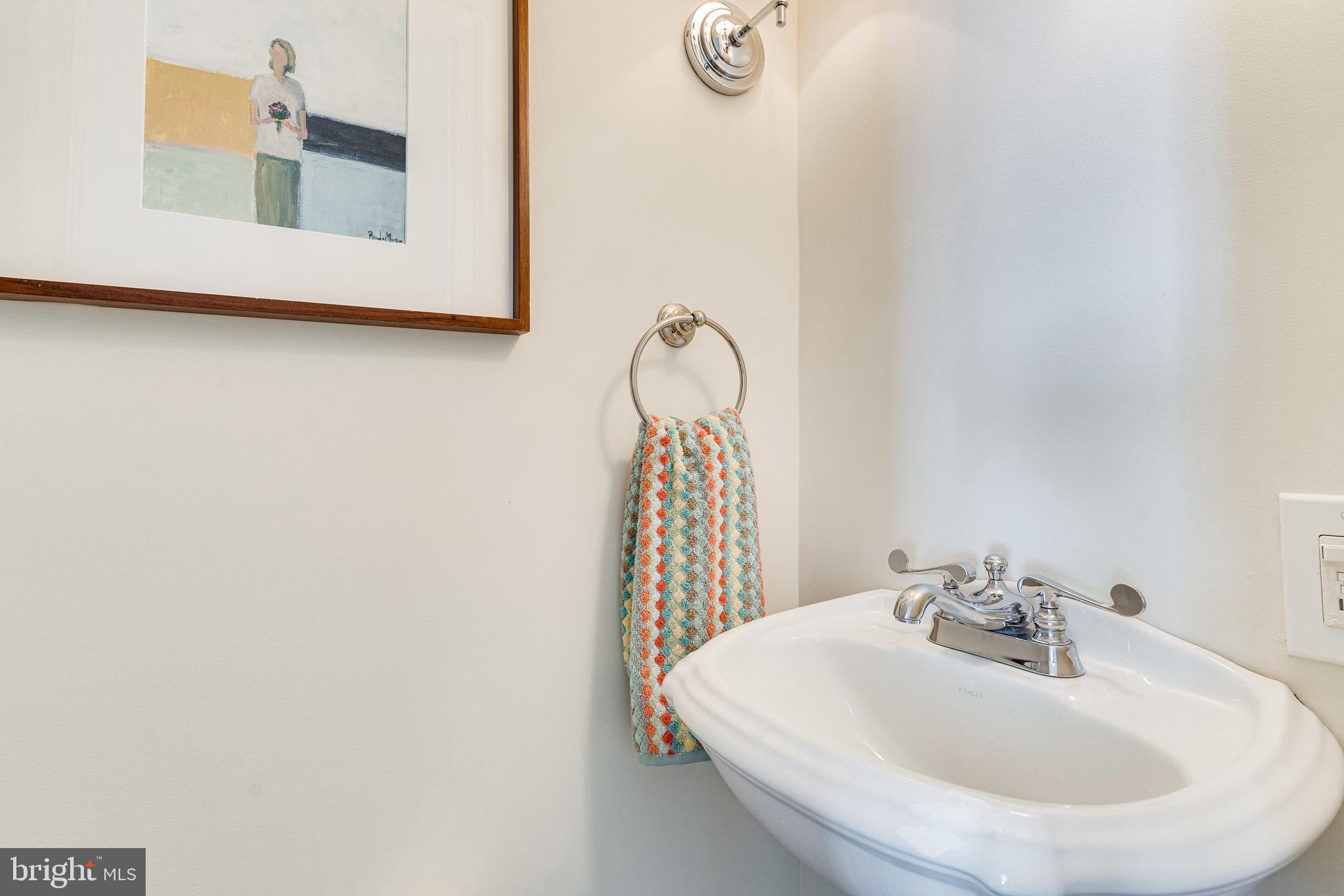 329 11th Street Southeast Washington, DC 20003 - Photo 16 of 49 a bathroom with a sink and a mirror