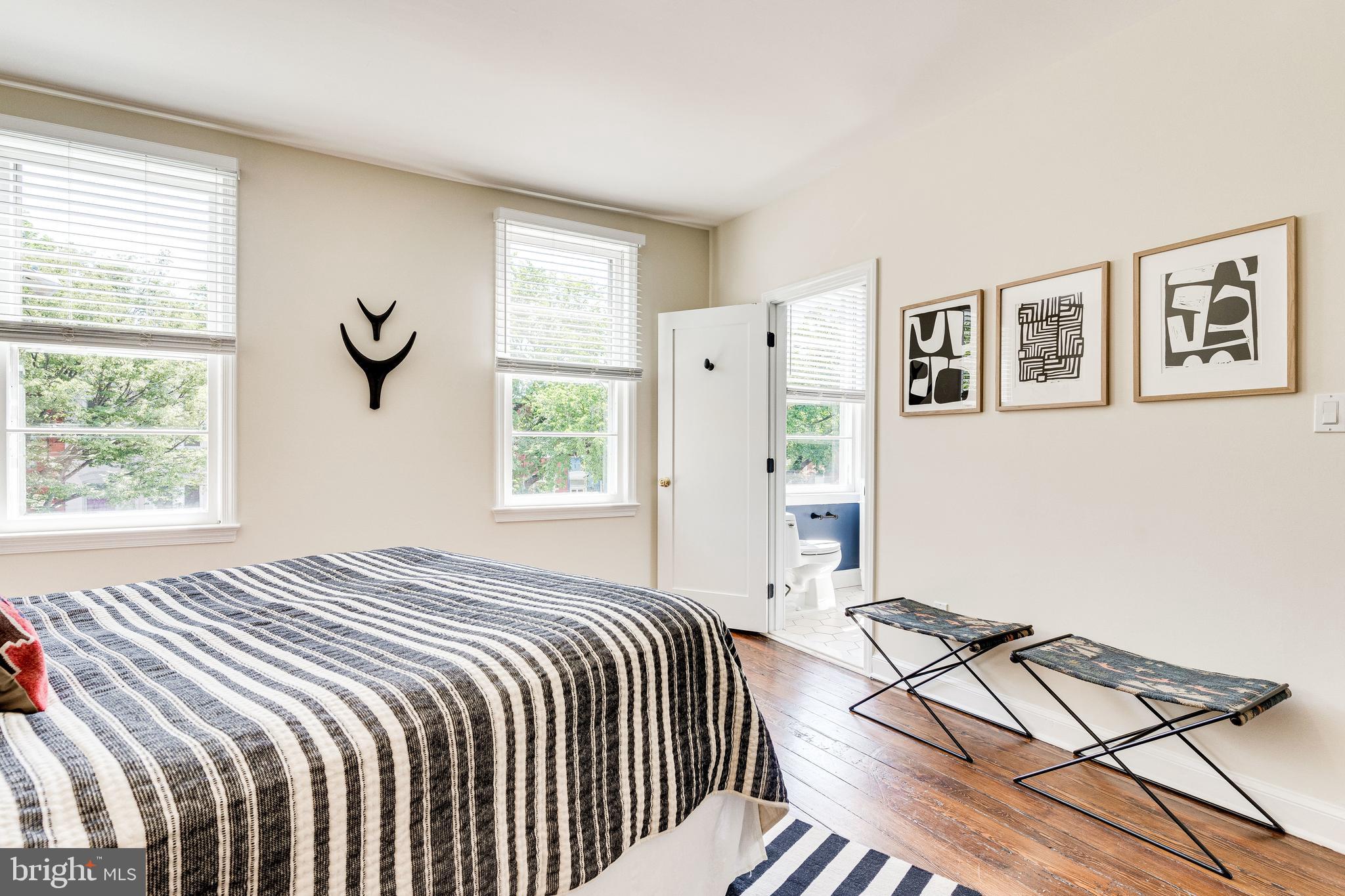329 11th Street Southeast Washington, DC 20003 - Photo 19 of 49 a bedroom with a bed and a window