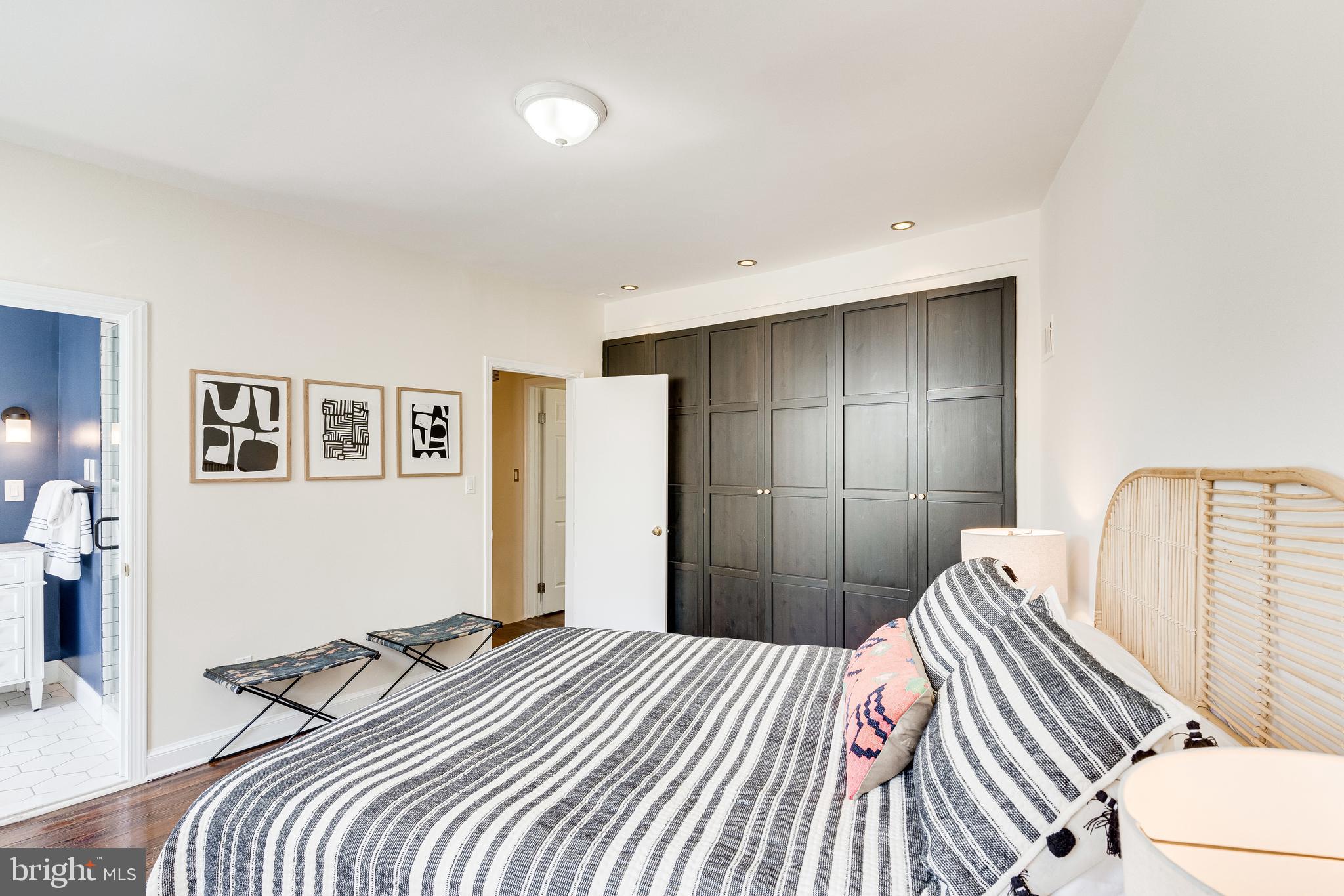 329 11th Street Southeast Washington, DC 20003 - Photo 21 of 49 a bedroom with a bed and wall painting