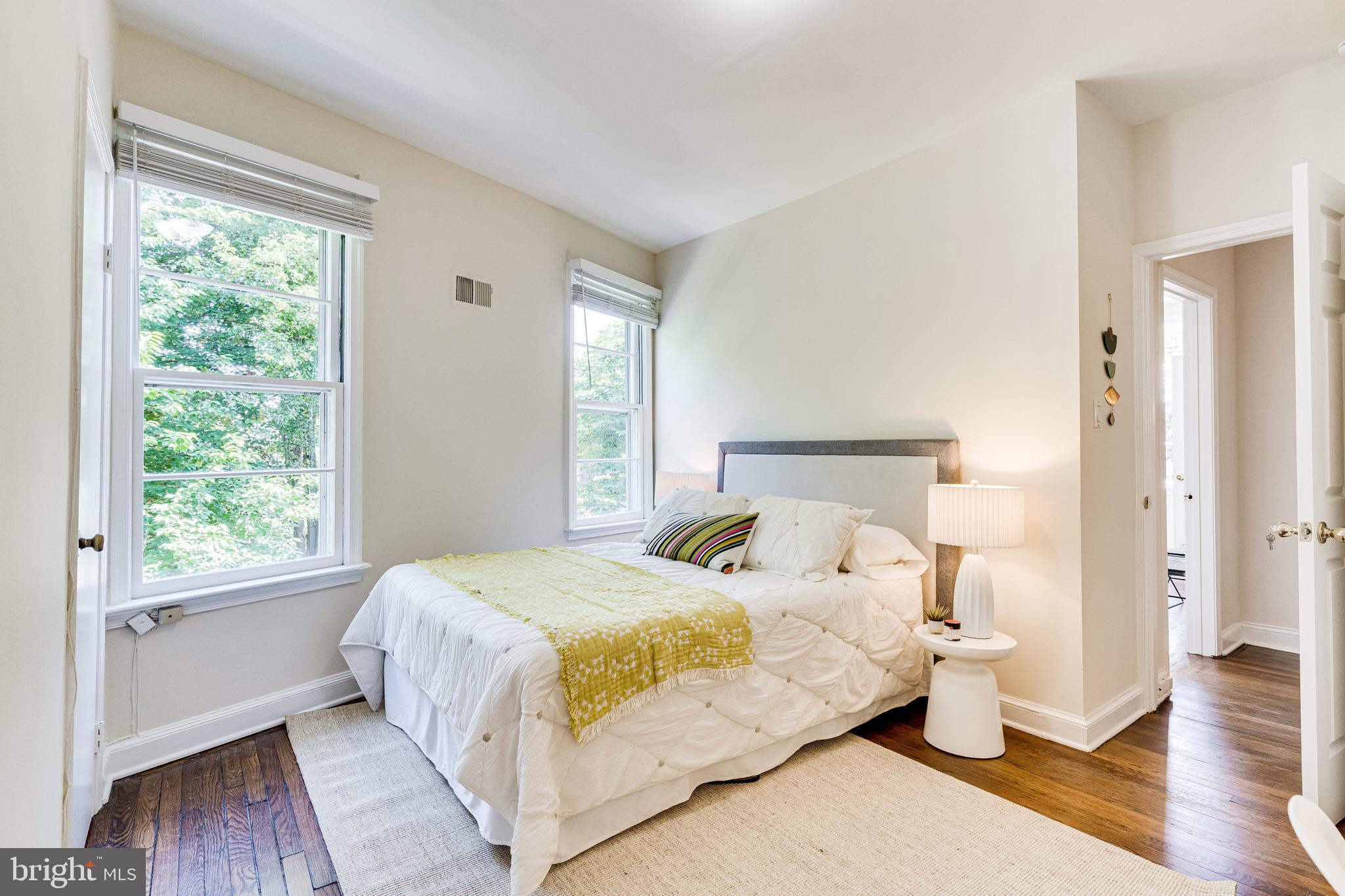329 11th Street Southeast Washington, DC 20003 - Photo 24 of 49 a bedroom with a bed and wooden floor