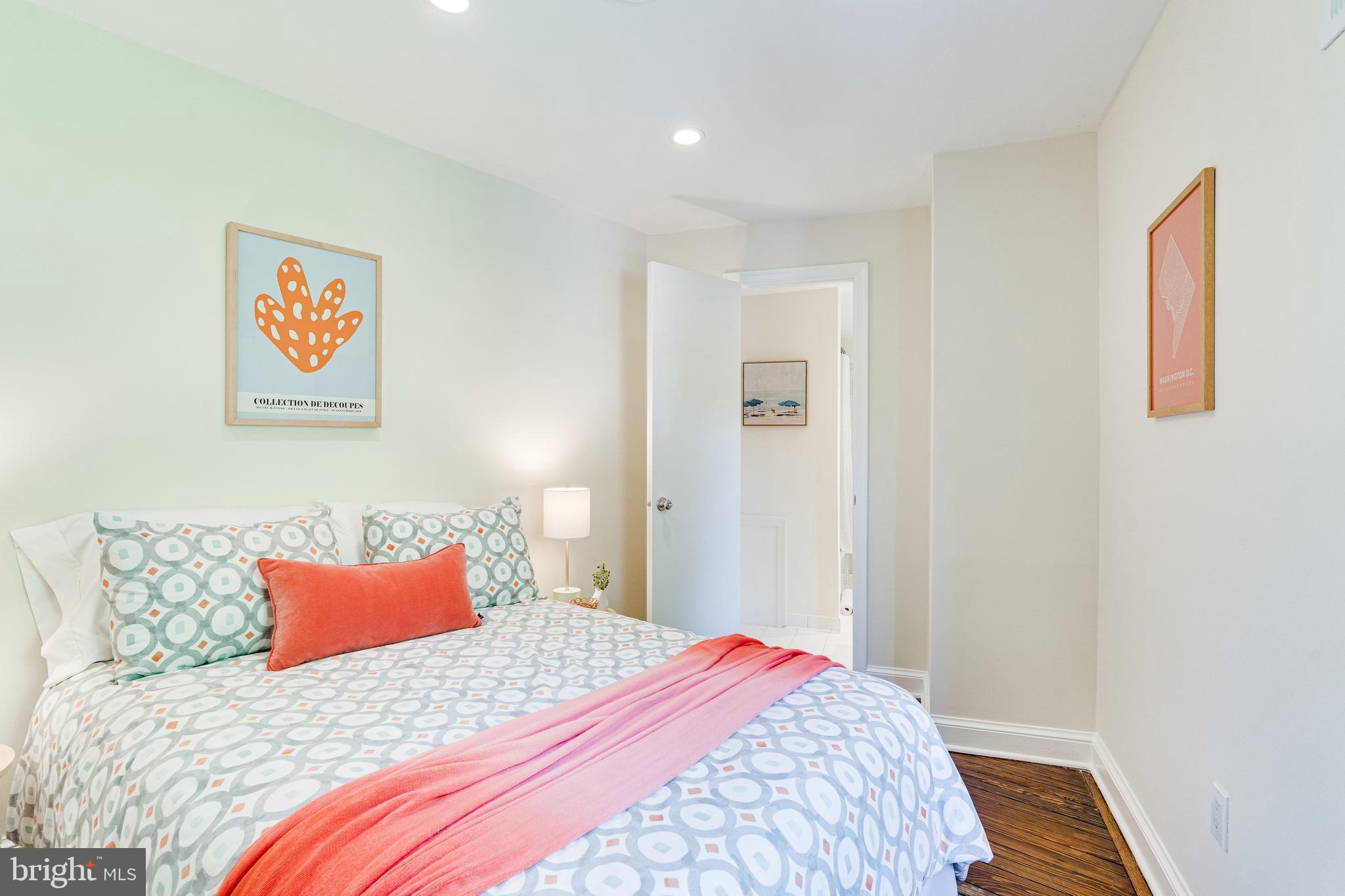 329 11th Street Southeast Washington, DC 20003 - Photo 26 of 49 a bedroom with a bed and a painting on the wall