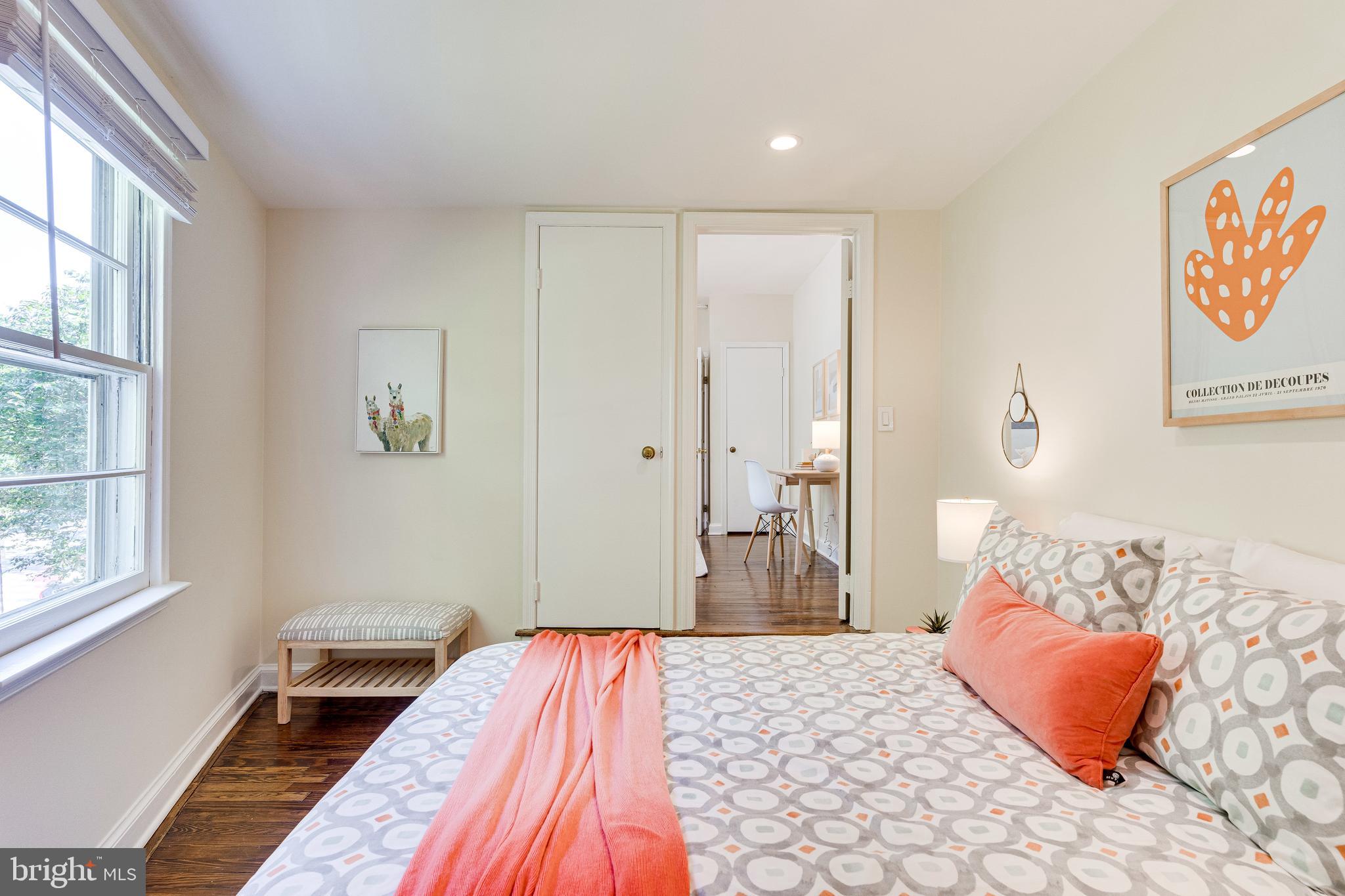 329 11th Street Southeast Washington, DC 20003 - Photo 27 of 49 a bedroom with a bed and a window