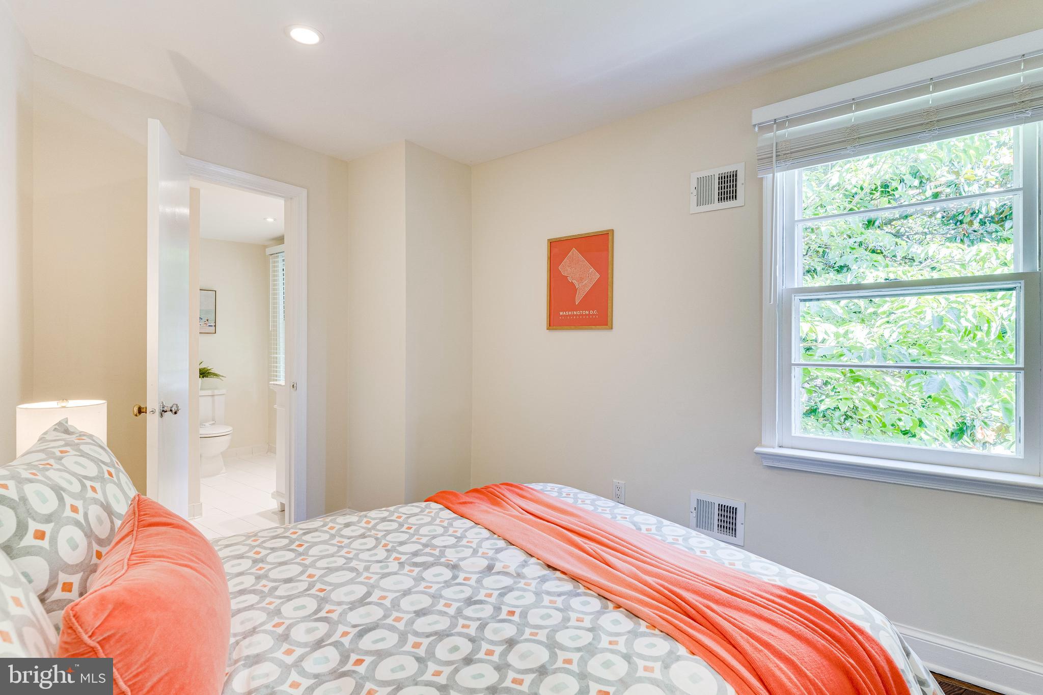 329 11th Street Southeast Washington, DC 20003 - Photo 28 of 49 a bedroom with bed and a window