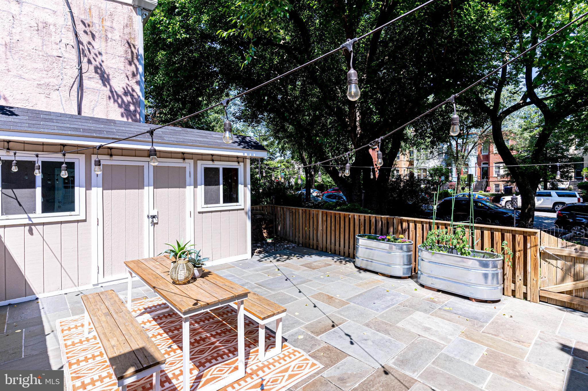 329 11th Street Southeast Washington, DC 20003 - Photo 30 of 49 a view of backyard with a patio and outdoor seating