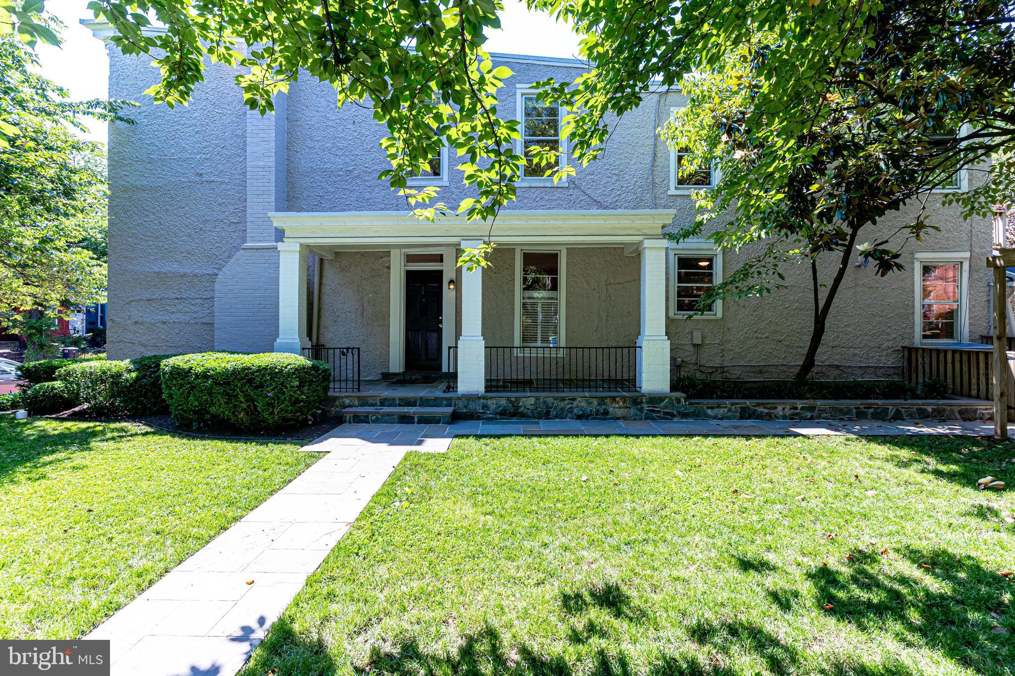 329 11th Street Southeast Washington, DC 20003 - Photo 37 of 49 a front view of a house with a yard