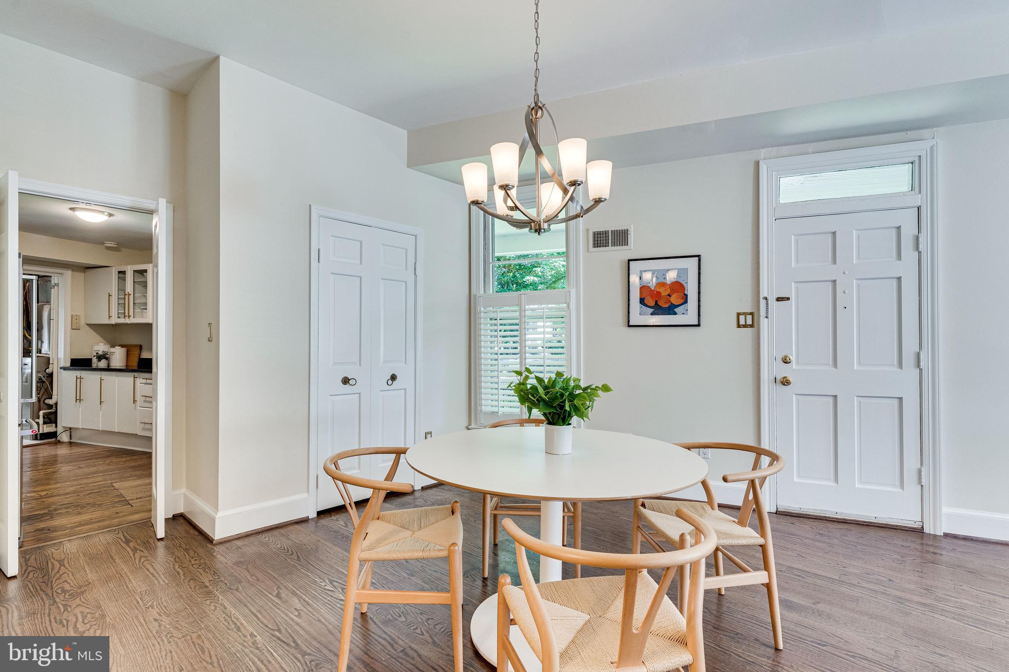329 11th Street Southeast Washington, DC 20003 - Photo 8 of 49 a view of a dining room with furniture wooden floor and a chandelier