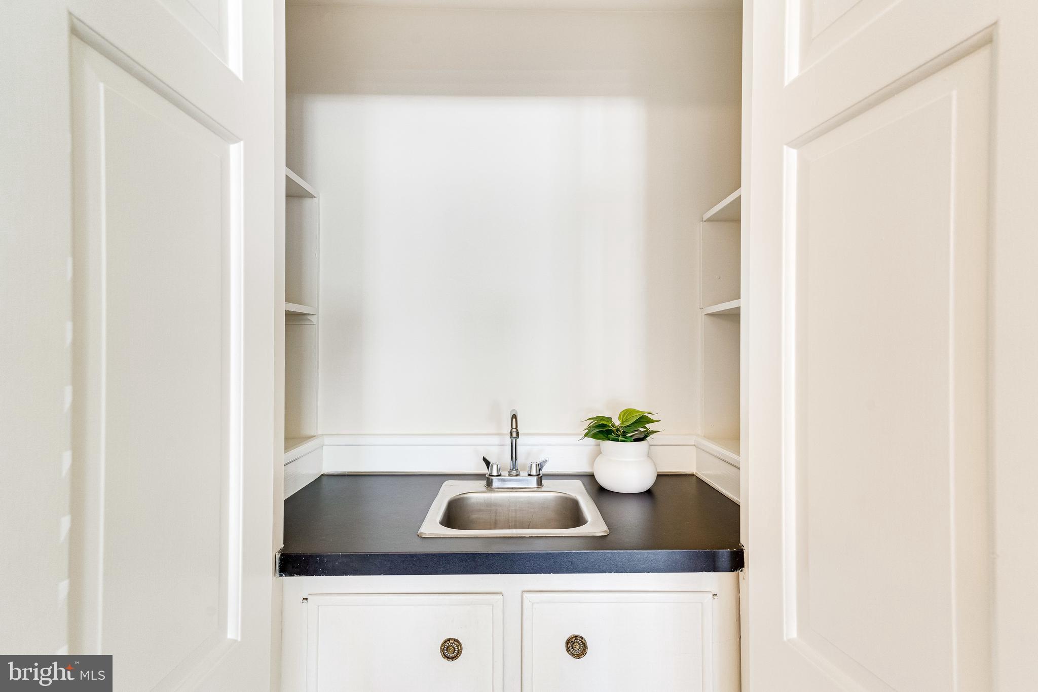329 11th Street Southeast Washington, DC 20003 - Photo 9 of 49 a bathroom with a sink and a window